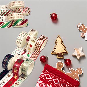 Assorted Christmas-themed decorative items including patterned ribbons, ornaments, wooden stars, and gingerbread man cookies on a light background.