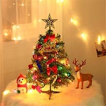 a small christmas tree with a red bow and a green reindeer.